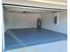 Attached garage with painted concrete floor and white walls at 12913 Sw 82Nd Avenue Rd, Ocala, FL 34473