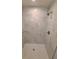 A bathroom shower with marble tile and glass shelf at 12913 Sw 82Nd Avenue Rd, Ocala, FL 34473