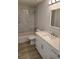 Beautiful bathroom featuring a quartz countertop, modern fixtures, and tiled shower at 12929 Sw 82Nd Avenue Rd, Ocala, FL 34473