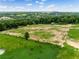 Aerial view of a large acreage lot surrounded by mature trees and landscaping at 13045 Mountain Trail, Clermont, FL 34715