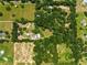 Wide aerial shot offering full view of a large wooded property at 13045 Mountain Trail, Clermont, FL 34715