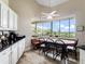 Cozy breakfast nook featuring a large picture window overlooking the scenic countryside at 13045 Mountain Trail, Clermont, FL 34715