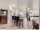 Open-concept kitchen boasting an island with bar seating, stainless steel appliances, and ample cabinet space at 13045 Mountain Trail, Clermont, FL 34715