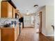 Well-lit kitchen with stainless steel appliances and wood cabinets at 13045 Mountain Trail, Clermont, FL 34715