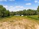 Expansive lot ready for development, featuring lush greenery and mature trees, perfect for building at 13045 Mountain Trail, Clermont, FL 34715