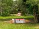 Outdoor obstacle course featuring rustic wooden jumps in a wooded setting, perfect for equestrian training at 13045 Mountain Trail, Clermont, FL 34715