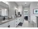 Bright bathroom with double vanity, modern fixtures, and stylish patterned tile floor at 1324 Utah Blvd, Orlando, FL 32803