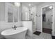 Bright bathroom showcasing a soaking tub, glass shower, and white plank accent wall at 1324 Utah Blvd, Orlando, FL 32803