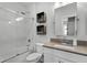 Bathroom featuring white subway tile in shower, vanity, and shelving at 1324 Utah Blvd, Orlando, FL 32803