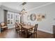 Bright dining room with modern chandelier, hardwood floors, and seating for six at 1324 Utah Blvd, Orlando, FL 32803