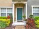 Inviting front door with attractive landscaping and a cozy entrance at 1410 Stockton Dr, Sanford, FL 32771