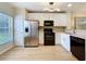 Stylish kitchen featuring modern lighting fixtures and stainless steel appliances at 1410 Stockton Dr, Sanford, FL 32771