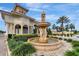 Beautiful fountain at the entrance to Tuscany Preserve, surrounded by well-manicured landscaping at 1411 Pacific Rd, Poinciana, FL 34759