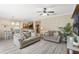 Comfortable living room featuring neutral furniture, ceiling fan, and decorative accents at 1411 Pacific Rd, Poinciana, FL 34759