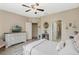 Spacious main bedroom featuring wood-look floors and an en-suite bathroom at 1411 Pacific Rd, Poinciana, FL 34759