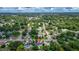 Aerial view of a neighborhood highlighting the property's location amidst lush trees and nearby amenities at 1412 Lakecrest Dr, Apopka, FL 32703