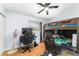 Comfortable bedroom featuring a bunk bed, desk, and fan for a functional and playful space at 1412 Lakecrest Dr, Apopka, FL 32703