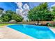 Sparkling in-ground pool with a spacious deck, perfect for summer fun and relaxation at 1412 Lakecrest Dr, Apopka, FL 32703