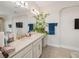 Bright bathroom featuring a wide vanity with double sinks and a large mirror at 14504 Sunbridge Cir, Winter Garden, FL 34787