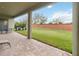 Covered patio area featuring brick pavers, offering ample space for outdoor seating and entertaining at 14504 Sunbridge Cir, Winter Garden, FL 34787