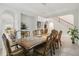 Elegant dining room featuring an ornate wooden table and chairs with modern lighting at 14504 Sunbridge Cir, Winter Garden, FL 34787