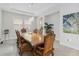 Elegant dining room featuring an ornate wooden table and chairs with modern lighting at 14504 Sunbridge Cir, Winter Garden, FL 34787