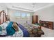 Primary bedroom featuring ceiling fan, and a large window with a fireplace and wardrobe at 14504 Sunbridge Cir, Winter Garden, FL 34787