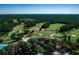 Scenic aerial view of the golf course highlighting its lush fairways, well-maintained greens, and natural surroundings at 1554 Eagle Nest Cir, Winter Springs, FL 32708