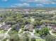 Bird's-eye view showing the home nestled in a leafy neighborhood near a park at 1554 Eagle Nest Cir, Winter Springs, FL 32708