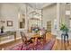 Formal dining room with elegant chandelier and views of the kitchen at 1554 Eagle Nest Cir, Winter Springs, FL 32708