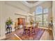 Formal dining room with an elegant chandelier and large windows for natural light at 1554 Eagle Nest Cir, Winter Springs, FL 32708