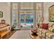 Living room featuring a view of the pool, with a piano and comfortable seating at 1554 Eagle Nest Cir, Winter Springs, FL 32708