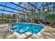 Sparkling swimming pool with a screened-in enclosure, lush landscaping, and plenty of space for lounging at 1554 Eagle Nest Cir, Winter Springs, FL 32708