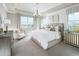 Serene main bedroom with plush carpet, large windows, and a tray ceiling offering abundant natural light at 16417 Silver Brook Way, Winter Garden, FL 34787