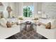 Sitting room featuring four armchairs with a decorative area rug, accent furniture, and view of the outdoors at 16417 Silver Brook Way, Winter Garden, FL 34787