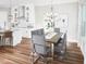 Dining area adjacent to kitchen with modern table, seating for six, and stylish chandelier at 16450 Silver Grove Blvd, Winter Garden, FL 34787