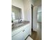 Bathroom with granite vanity, modern fixtures, and a view to an adjacent bedroom at 1714 Sherbourne St, Winter Garden, FL 34787