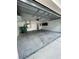 Spacious two car garage with concrete floor and attached storage cabinets at 1714 Sherbourne St, Winter Garden, FL 34787