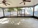 Screened lanai with tile flooring overlooking a paved patio and fenced yard at 1714 Sherbourne St, Winter Garden, FL 34787