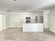 View of the kitchen from the living room shows the open floor plan and stylish flooring at 1714 Sherbourne St, Winter Garden, FL 34787