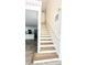 Staircase with natural wood treads and white risers leading to the upper level at 1714 Sherbourne St, Winter Garden, FL 34787