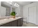 Bathroom featuring a double vanity, large mirror, and modern toilet at 1744 Wilson Prairie Cir, Groveland, FL 34736