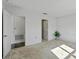 Carpeted bedroom with doorways to other rooms and a white louvered closet at 1744 Wilson Prairie Cir, Groveland, FL 34736