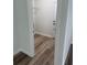 Hallway with walk-in closet and view of the front door at 1926 Sw 160Th Sw Pl # 03, Ocala, FL 34470