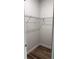 This walk-in closet offers shelving, wood-look flooring and is freshly painted at 1926 Sw 160Th Sw Pl # 03, Ocala, FL 34470