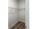 This walk-in closet offers shelving, wood-look flooring and is freshly painted at 1926 Sw 160Th Sw Pl # 03, Ocala, FL 34470