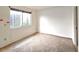 Empty bedroom with neutral carpet, natural light, and standard electrical outlets at 2452 Atrium Cir, Orlando, FL 32808