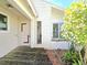 Entrance to the house, showcasing a combination of architectural elements and nature at 2452 Atrium Cir, Orlando, FL 32808