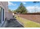 A private backyard featuring green space, concrete and a brick wall at 2913 Ashford Park Pl, Oviedo, FL 32765