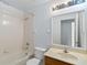 Bright bathroom featuring a shower-tub combination and marble vanity at 2913 Ashford Park Pl, Oviedo, FL 32765